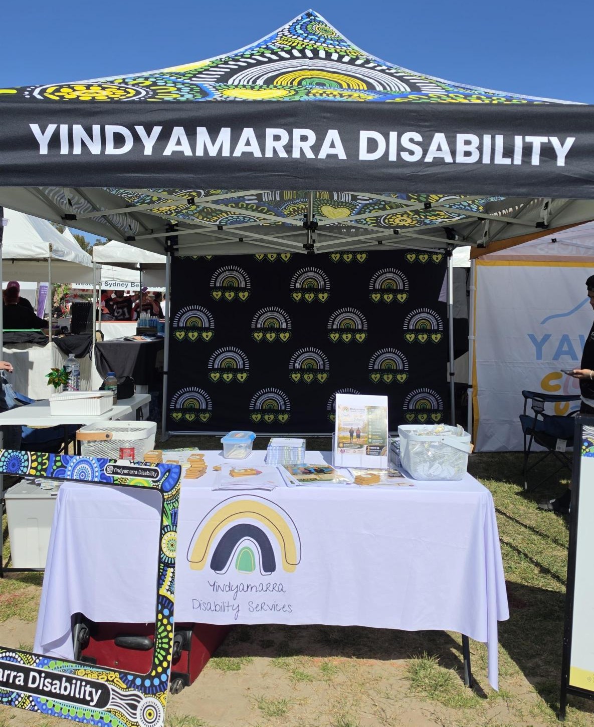 Yindyamarra Disability marquee and information stall at a community event